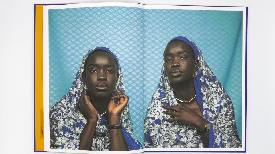 Image of an open photobook by Atong Atem